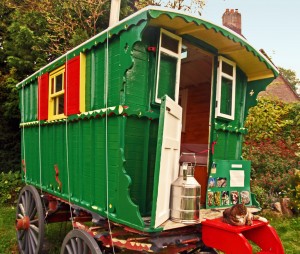 A Bright green traditional gypsy caravan