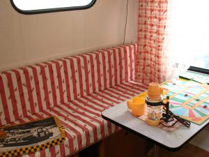 Retro caravan living area in red and white