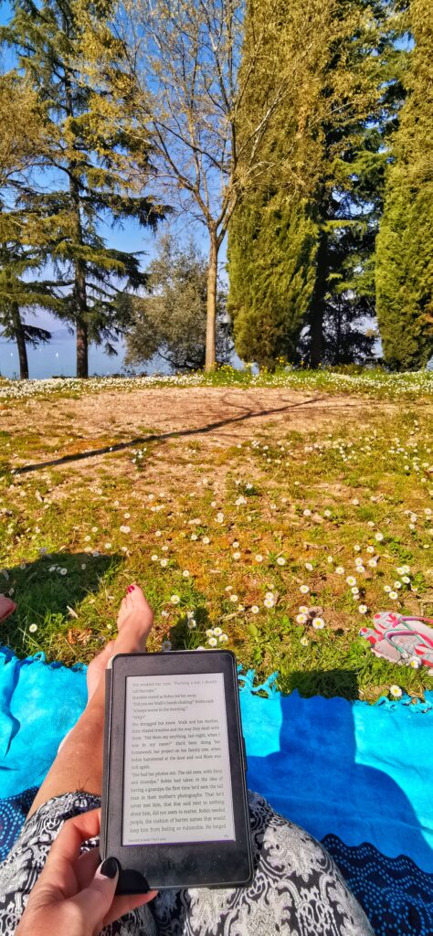 reading on the shores of Lake Garda