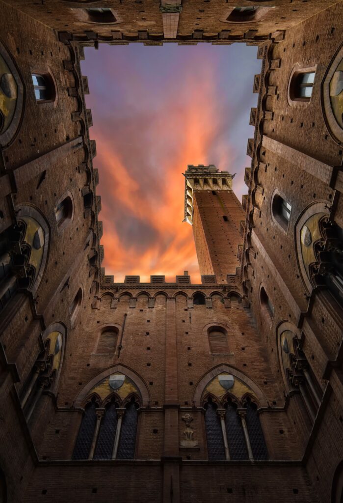Inside the Palazzo Pubblico looking up towards the iconic tower of Siena in Tuscany