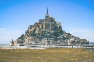 Mont Saint Michel in Normandy, Northern France, is a tidal island and home to a small commune of people.
