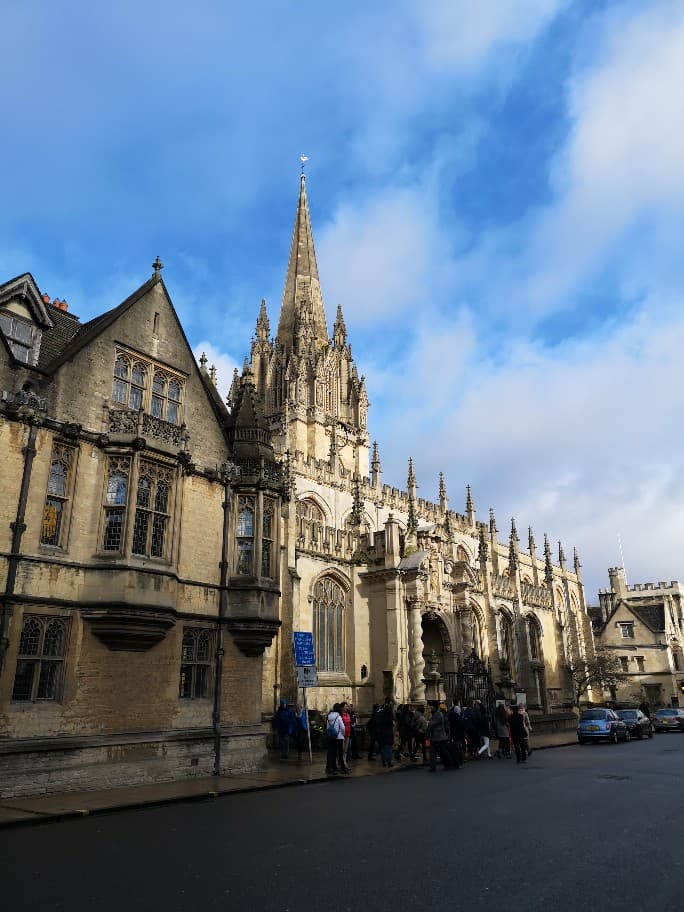 A street in Oxford, known for its gothic spires and cream coloured sandstone building rich with history and well-known writers.