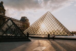 Paris and the Louvre museum's iconic pyramid at sunrise