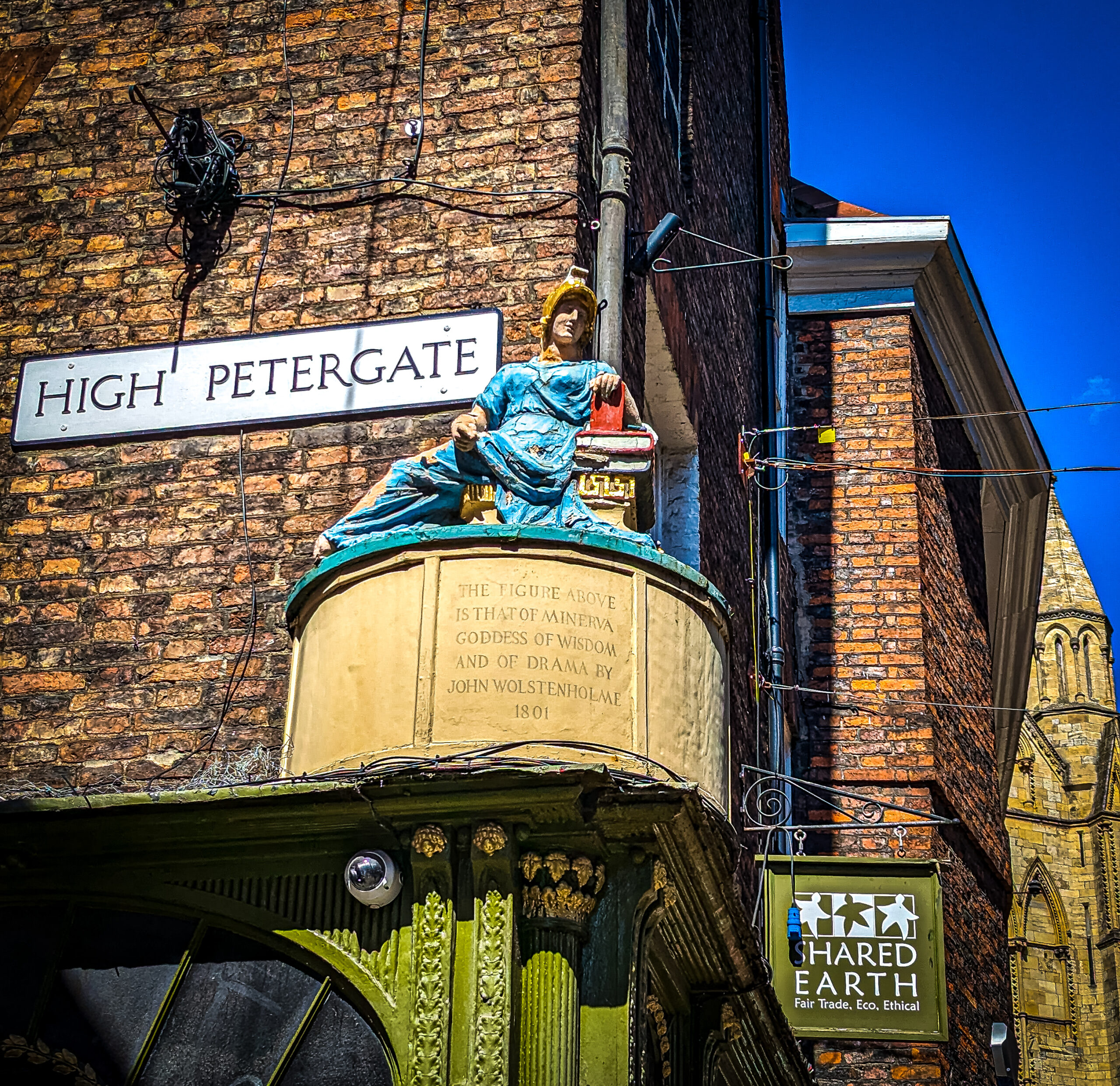 The statue of Minerva high up on the street in York near the York Minister 